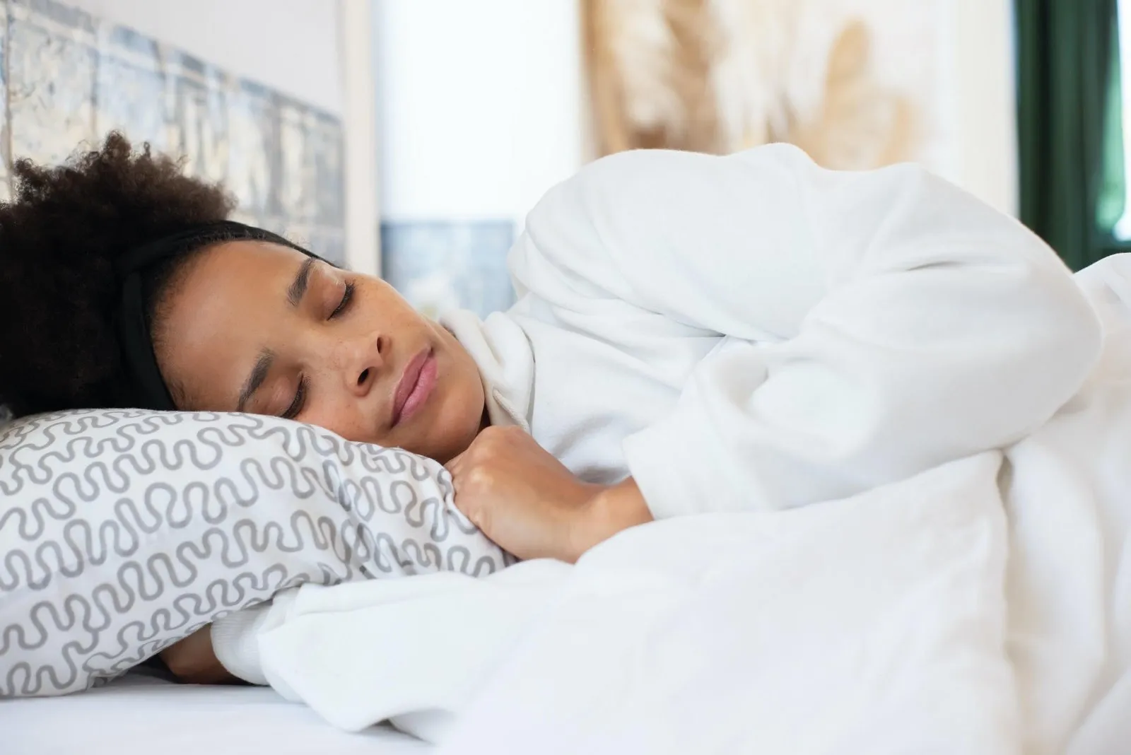 A woman sleeping peacefully in bed